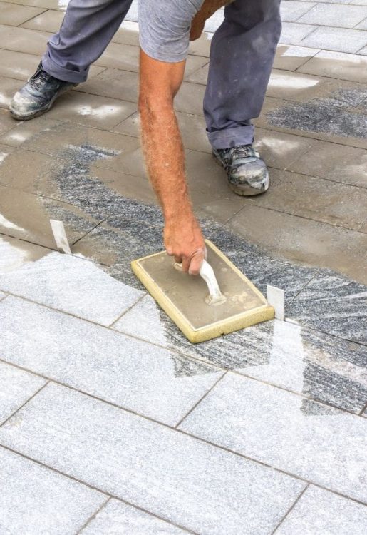Careers Worker grouting tiles